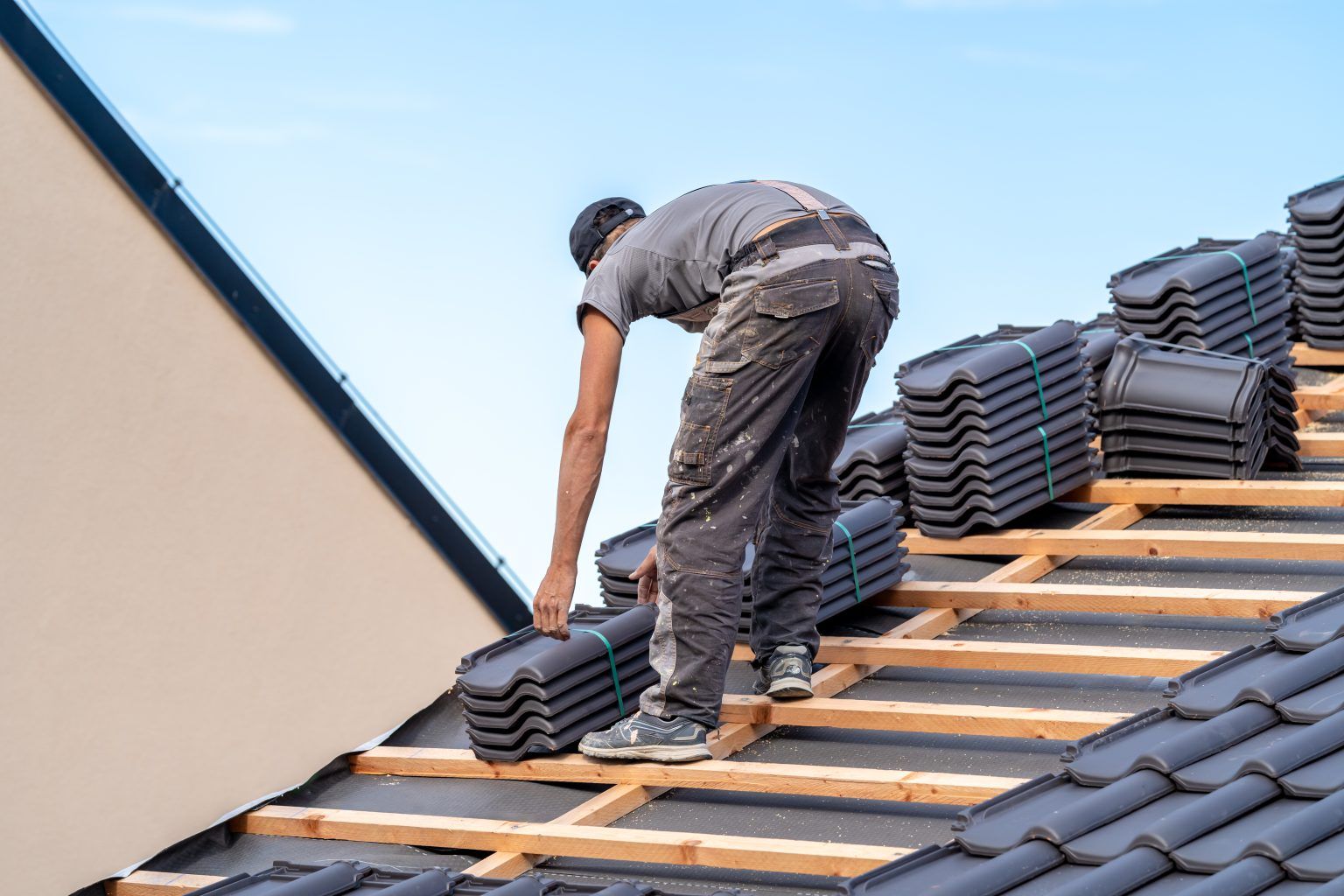 new-roof-of-a-family-house-a-roofer-builds-a-roof-2023-11-27-05-34-10-utc-1536x1024